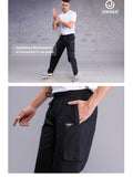 Black cotton pants for men with cargo-style pockets